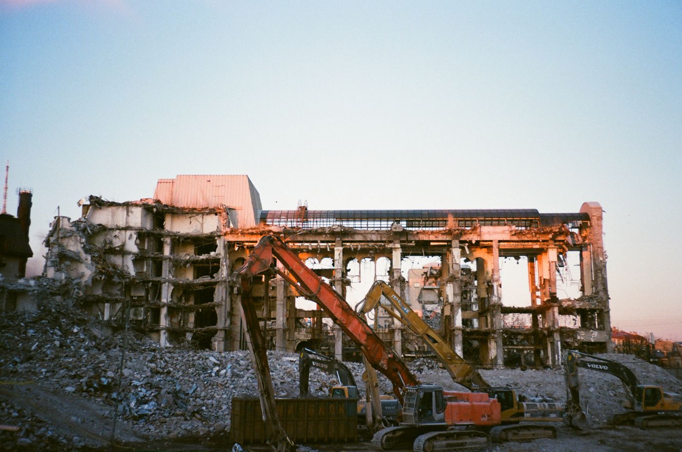 Building demolition site with machinery clearing debris