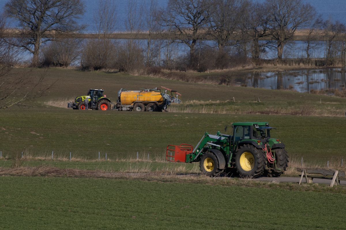 Farm machinery working across a rural property
